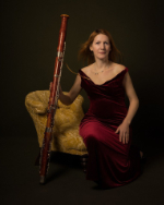 Helen Storey sitting whilst holding her bassoon.